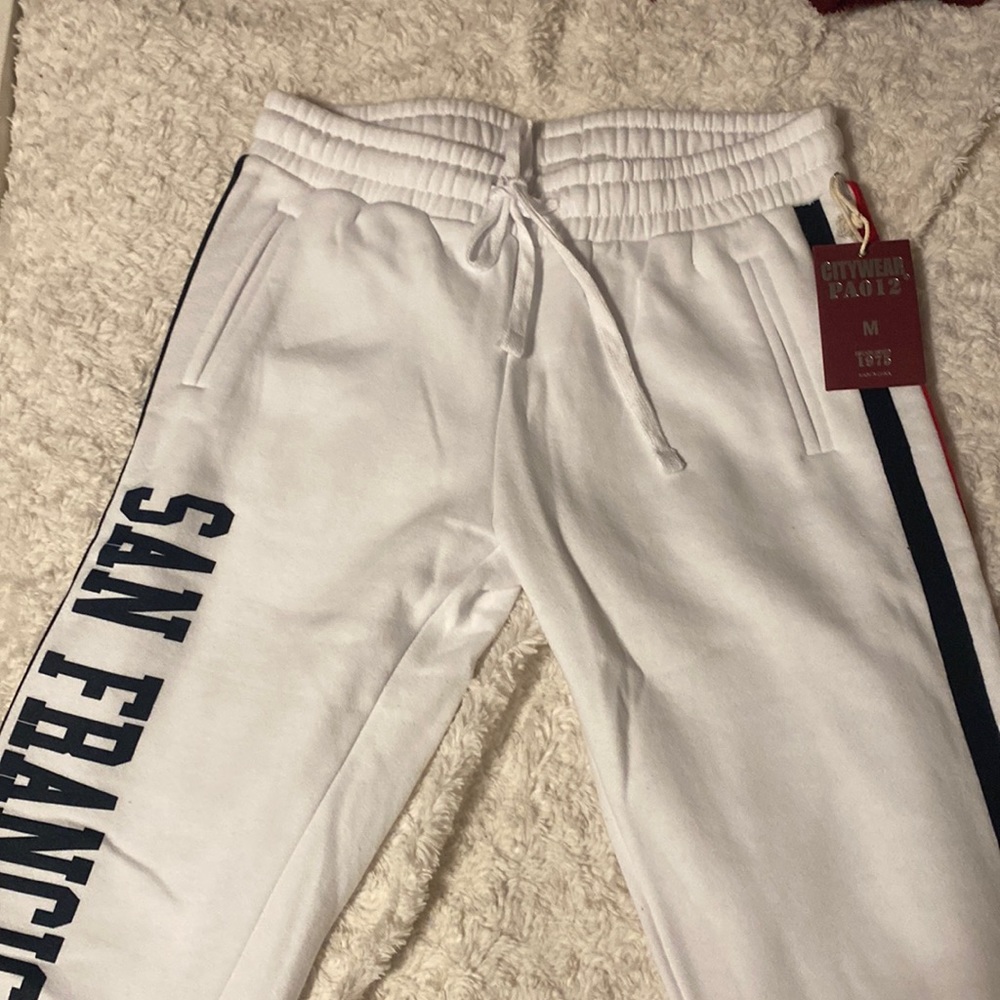 California white sweatpants 🤍 with dark blue and red striped ❤️💙